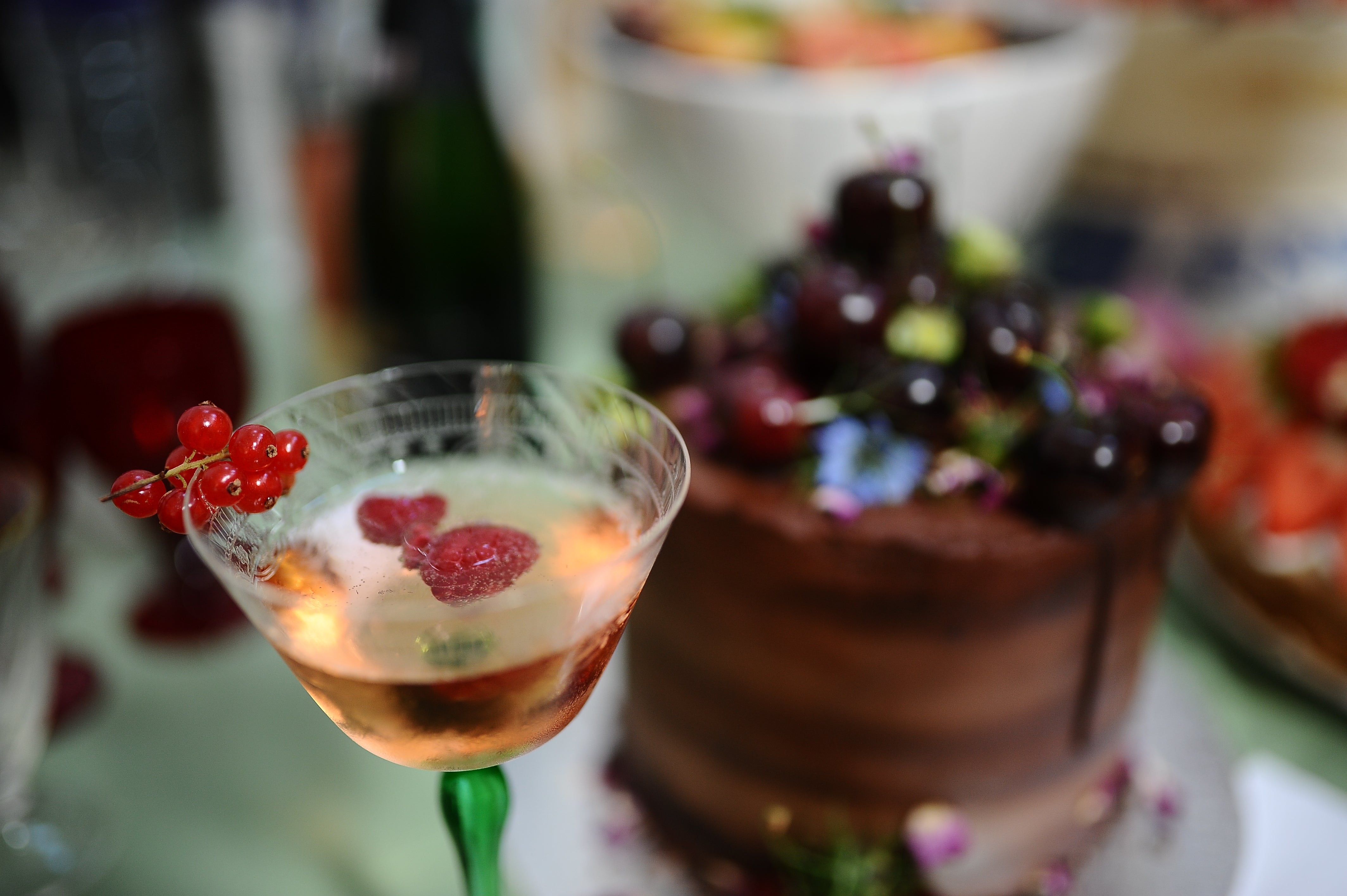 solid wooden table with party food and drink, dining and celebrating in style